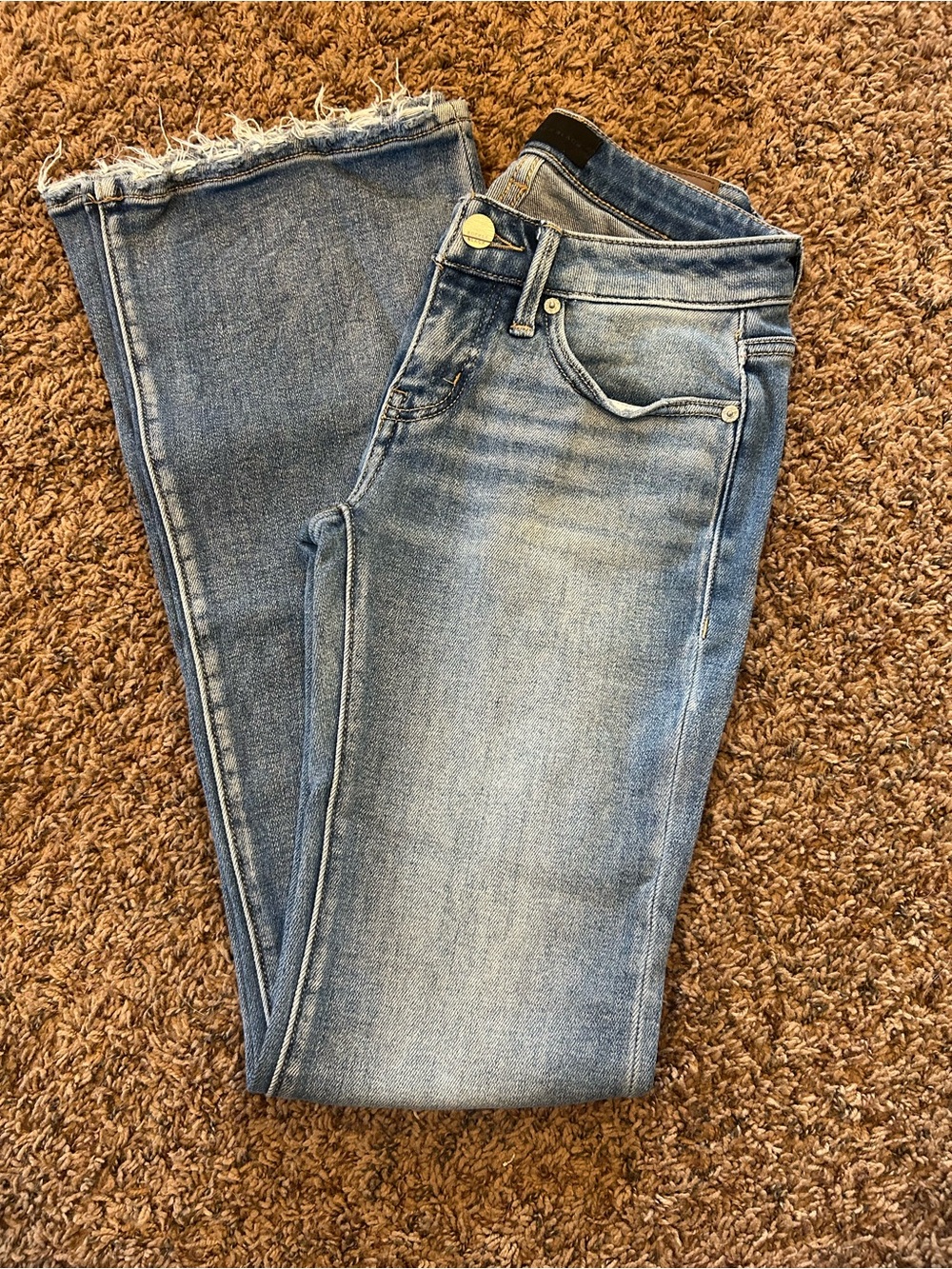 Buckle Light Blue Flared Jeans with Frayed Hem